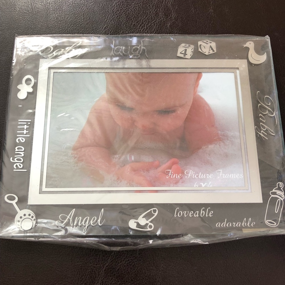 Two Baby glass picture frames.